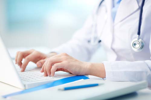Stock image of doctor on computer