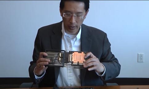 Steve Woo shows a copper plate whose job it is to whisk the heat away from the processor 